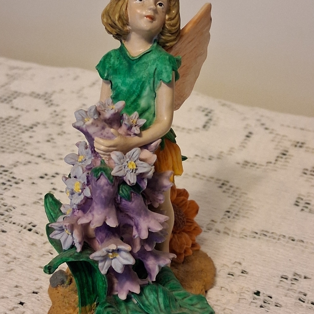 Charming Fairy Figurine with Green and Purple Accents